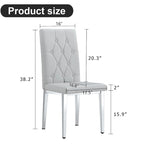 Chaise de salle à manger grise sans accoudoirs, avec dossier capitonné à motif quadrillé et clouté, et pieds en métal argenté.