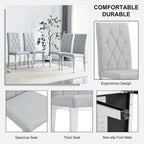 Chaise de salle à manger grise sans accoudoirs, avec dossier capitonné à motif quadrillé et clouté, et pieds en métal argenté.
