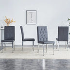 Chaise de salle à manger grise sans accoudoirs, avec dossier capitonné à motif quadrillé et clouté, et pieds en métal argenté.