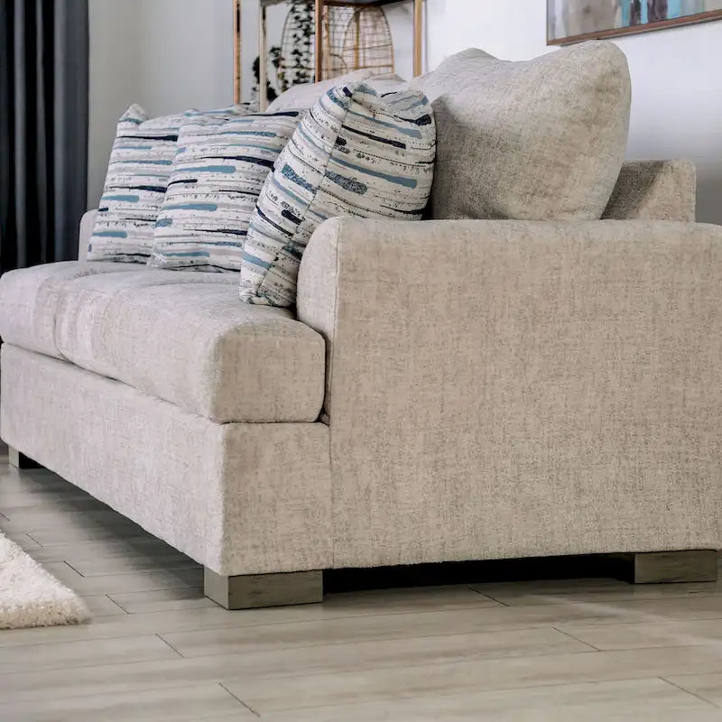 Canapé transitoire en tissu gris avec accoudoirs évasés et coussins de siège à ressorts