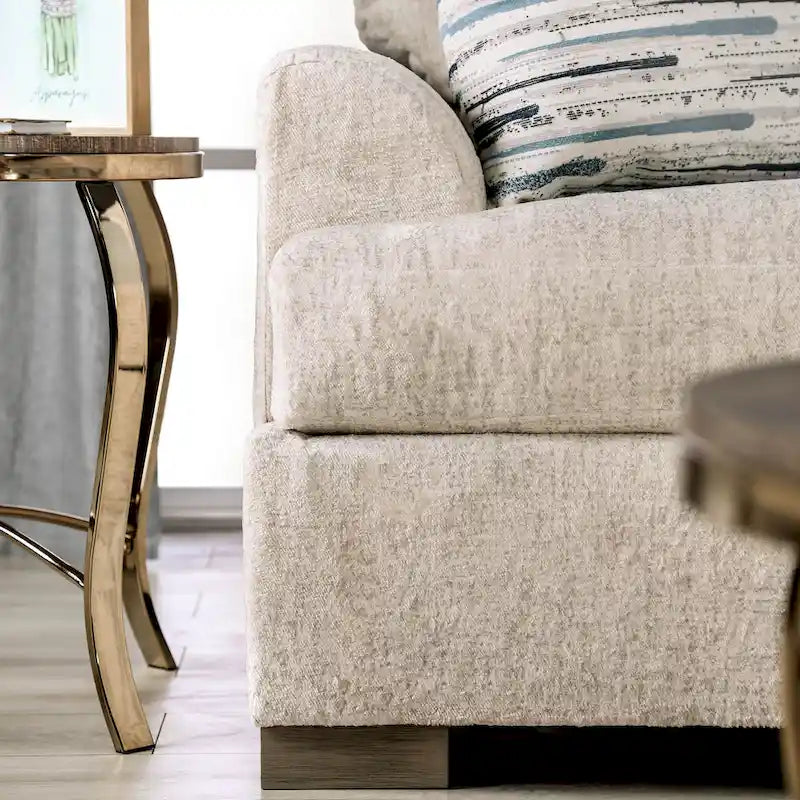 Canapé transitoire en tissu gris avec accoudoirs évasés et coussins de siège à ressorts