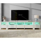 Meuble TV blanc cannelé en bois avec plateau à motif de pierre et lumière LED RGB